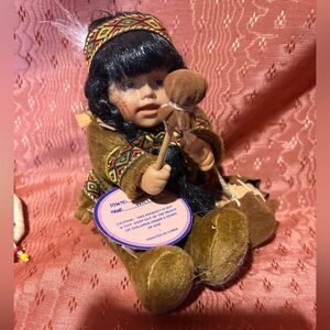 Brown and Black Doll with Drum